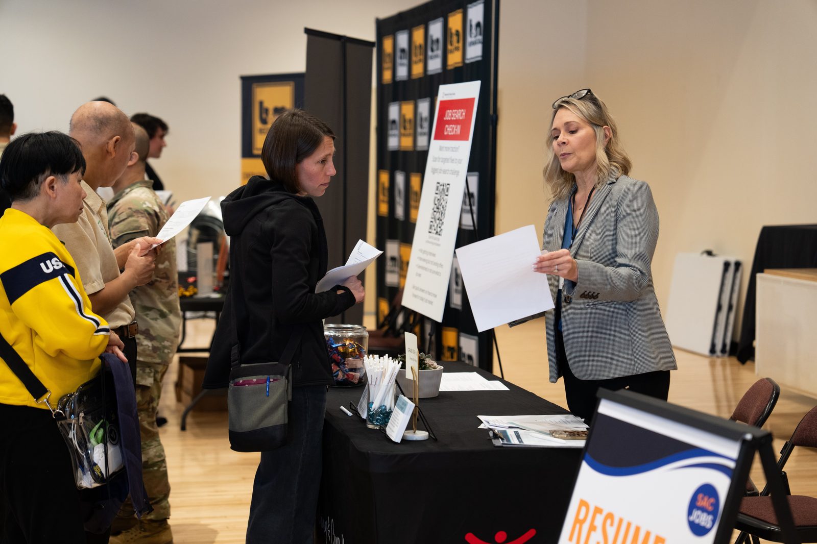 Candidate getting resume help at SacJobs Career Fair