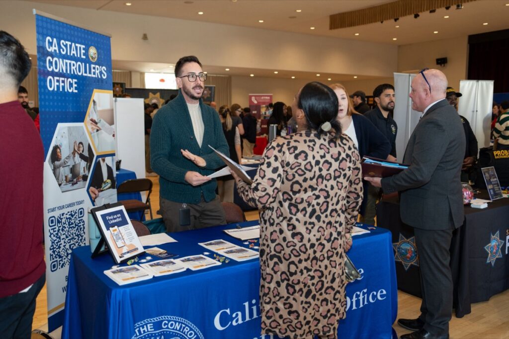 CA State Controller's Office recruiters talk with Candidates at a SacJobs career fair