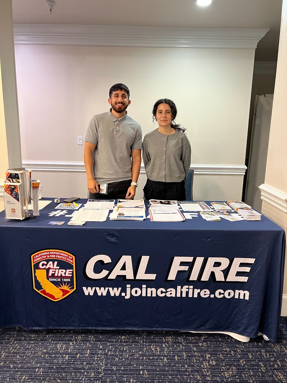 CAL FIRE recruiters at their table at a SacJobs career fair